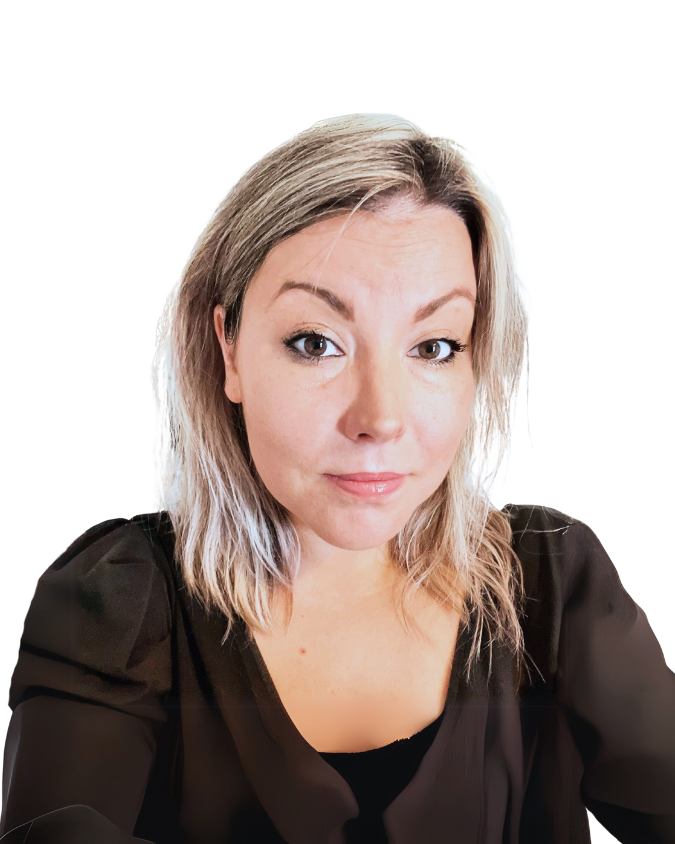 Woman with light hair and black blouse looking directly at the camera against a white background.